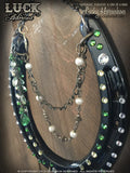 Emerald Isle Luck Adorned Lucky Horseshoe has a cool, oval centerpiece with big, chunky green stone in a cameo type setting along with different types of delicate, metal chain with faux pearls and green stone accents. Swarovski crystals are aplenty on this shoe in both white diamond and emerald green. 