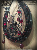 "Ruby Room" is a black and deep red shoe adorned with lots of dangles! Luck never looked so good!