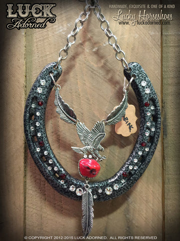 SOARING Luck Adorned Lucky Horseshoe is done on that super cool, metallic, gun metal grey with a hammered texture and has a cool eagle above a simulated coral stone with silver metal chain and feather accents.